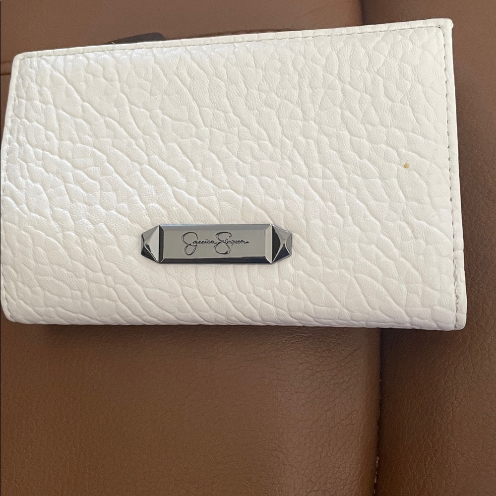 Jessica Simpson Cream Textured Wallet has a small mark on front but like new